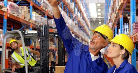 Workers Demonstrating Safety and Coordination in Modern Warehouse
