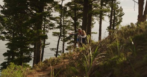 Couple Hiking Together in Peaceful Forest