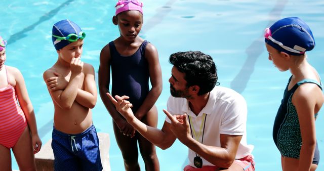 Swim Instructor Teaching Young Children at Poolside - Download Free Stock Images Pikwizard.com