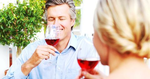 Happy Couple Enjoying Wine Together at Outdoor Restaurant Setting - Download Free Stock Images Pikwizard.com