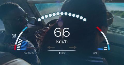 Driving duo using augmented reality hud displaying 66 km/h in car with lensflare sunlight