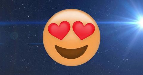 Heart-eyes emoji floating in cosmic starfield scene