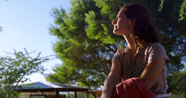 Relaxed Woman Enjoying Sunshine Outdoors - Download Free Stock Images Pikwizard.com