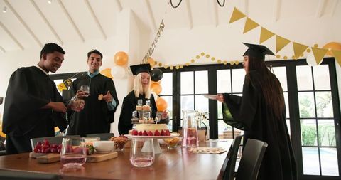 Diverse Friends Celebrating Graduation at Festive Party