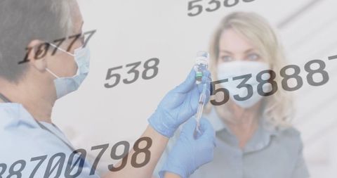 Healthcare Workers Administering Vaccine to Senior Woman Amid Pandemic