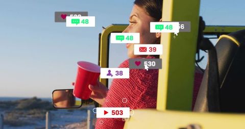Woman holding red cup in yellow jeep at coast with social media notification overlays