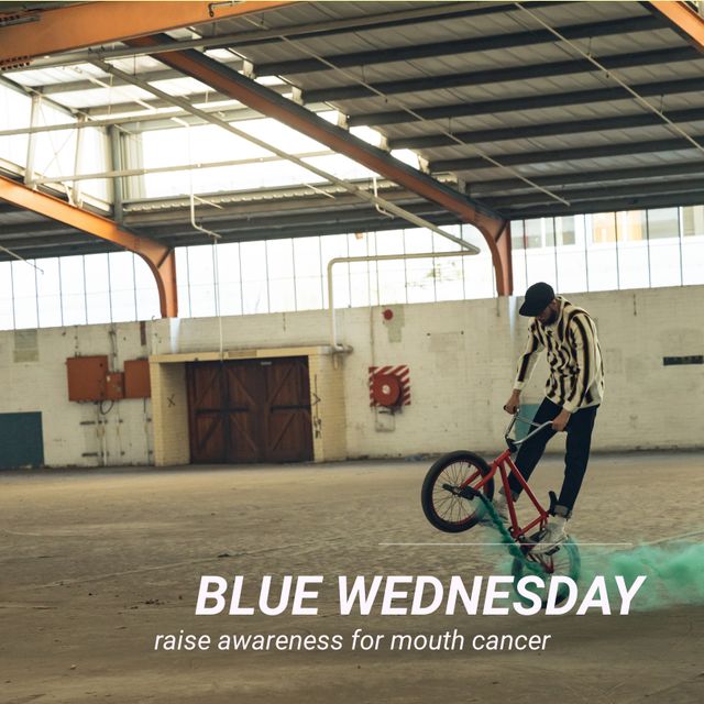 Stunt Biker Promoting Mouth Cancer Awareness in Industrial Setting - Download Free Stock Templates Pikwizard.com