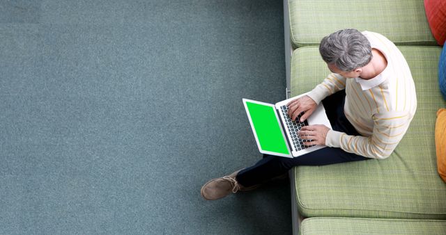 Mature Man Working on Laptop with Green Screen in Modern Office - Download Free Stock Images Pikwizard.com