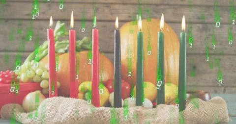 Burning kinara with digital binary overlay on rustic harvest table for kwanzaa celebration