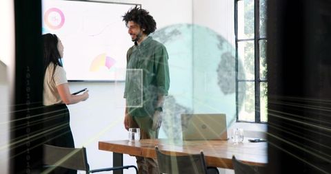 Team presenting data with augmented graphics in modern office meeting for collaboration