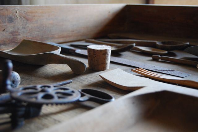 Selection of various crafting tools laid out on a wooden surface, perfect for illustrating concepts related to DIY projects, woodworking, carpentry, and handmade items. Ideal for use in blogs, advertisements, or educational materials focused on crafts and tool organization.