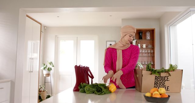 Woman Organizing Groceries in Modern Kitchen - Download Free Stock Images Pikwizard.com