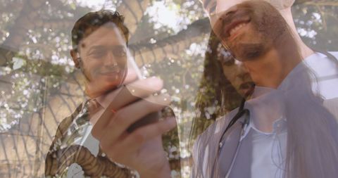 Business professionals collaborating outdoors using technology