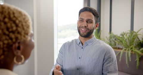 Businessman successfully collaborating with colleague in professional setting