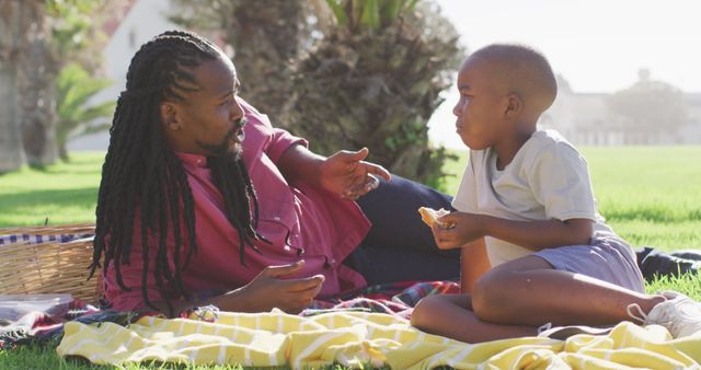 Father and Son Bonding During Outdoor Picnic - Download Free Stock Images Pikwizard.com