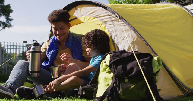 Father and Son Enjoying Camping in Yard with Thermos - Download Free Stock Images Pikwizard.com