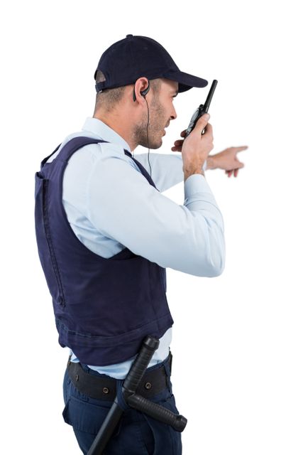 Security officer talking on walkie-talkie against white background