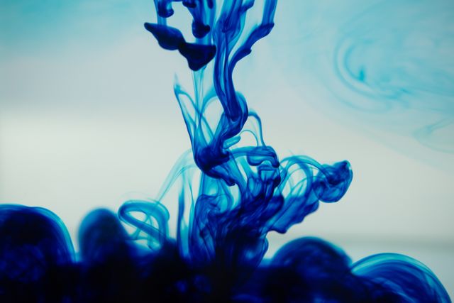 Close-Up of Blue Ink Spreading in Water - Download Free Stock Photos Pikwizard.com
