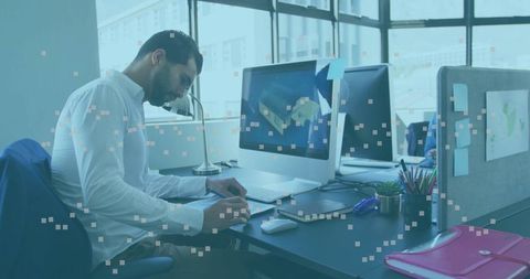 Middle Eastern Professional Working at Modern Office Desk
