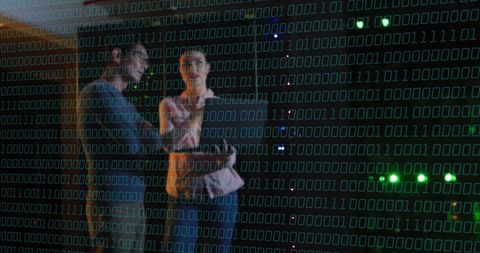 Binary Code Overlay with IT Professionals in Data Center - Download Free Stock Images Pikwizard.com