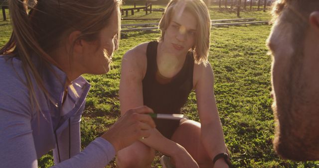 Group of Athletes Having Strategy Meeting Outdoors at Sunset - Download Free Stock Images Pikwizard.com