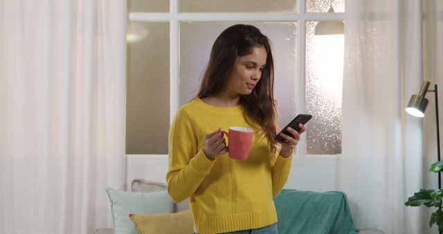 Woman Drinking Coffee While Using Smartphone at Home - Download Free Stock Images Pikwizard.com