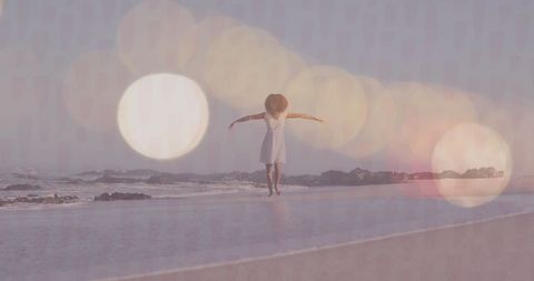 joyful woman with outstretched arms on the beach at sunset - Download Free Stock Images Pikwizard.com