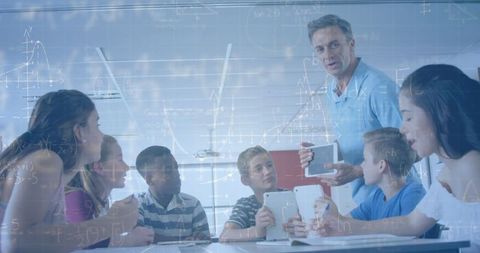 educator teaching technology to diverse students with mathematical overlay - Download Free Stock Images Pikwizard.com