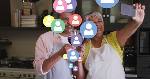 Elderly Couple Enjoying Wine with Digital Social Media Overlay