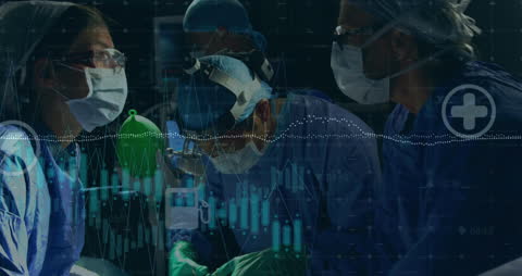 Medical Team Analyzing Data in Operating Room Environment