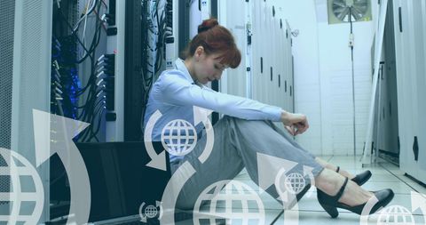 Thoughtful IT Professional in Data Center Floor with Laptop