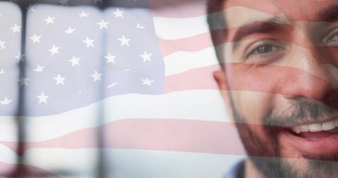 Cheerful Businessman with USA Flag Overlay in Office