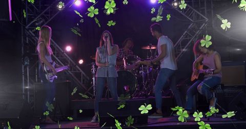 Band Performing on Stage with Falling Shamrocks for St. Patrick's Day - Download Free Stock Images Pikwizard.com