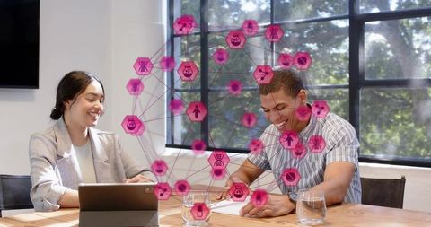 Colleagues collaborating with augmented reality data overlay while reviewing documents