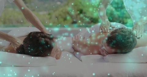 Couple Enjoying Relaxing Outdoor Massage with Ambient Lighting