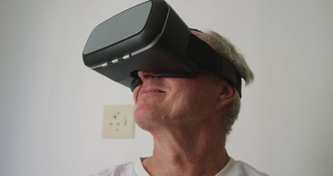 Senior Man Using Virtual Reality Headset for Entertainment - Download Free Stock Images Pikwizard.com