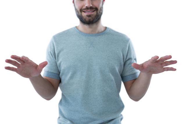 Man pretending to touch an invisible object against white background