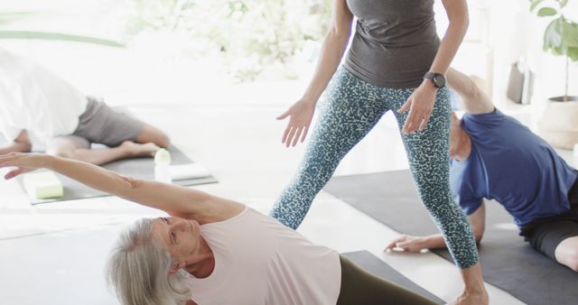 Senior Woman Practicing Yoga in Group Class Setting - Download Free Stock Images Pikwizard.com