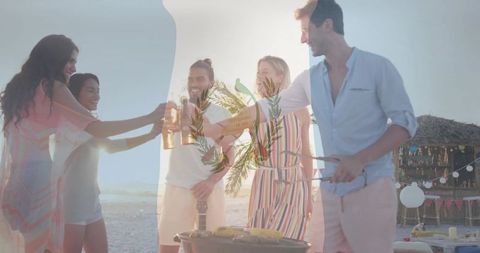 Friends Enjoying Sunset Beach Barbecue with Drinks