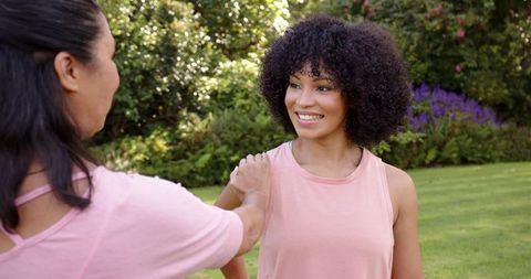 Friends Smiling and Bonding in Serene Outdoor Setting