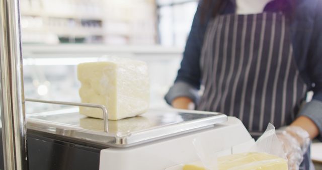 Cheese Shop Worker Weighing Cheese at Counter - Download Free Stock Images Pikwizard.com