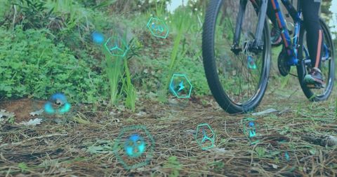 Eco-Friendly Mountain Biking with Sustainability Icons in Motion