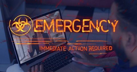 Remote worker watching biohazard emergency alert on laptop, immediate action required