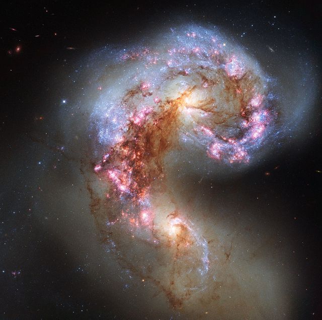 The NASA/ESA Hubble Space Telescope has snapped the best ever image of the Antennae Galaxies. Hubble has released images of these stunning galaxies twice before, once using observations from its Wide Field and Planetary Camera 2 (WFPC2) in 1997, and again in 2006 from the Advanced Camera for Surveys (ACS). Each of Hubble’s images of the Antennae Galaxies has been better than the last, due to upgrades made during the famous servicing missions, the last of which took place in 2009.  The galaxies — also known as NGC 4038 and NGC 4039 — are locked in a deadly embrace. Once normal, sedate spiral galaxies like the Milky Way, the pair have spent the past few hundred million years sparring with one another. This clash is so violent that stars have been ripped from their host galaxies to form a streaming arc between the two. In wide-field images of the pair the reason for their name becomes clear — far-flung stars and streamers of gas stretch out into space, creating long tidal tails reminiscent of antennae.  This new image of the Antennae Galaxies shows obvious signs of chaos. Clouds of gas are seen in bright pink and red, surrounding the bright flashes of blue star-forming regions — some of which are partially obscured by dark patches of dust. The rate of star formation is so high that the Antennae Galaxies are said to be in a state of starburst, a period in which all of the gas within the galaxies is being used to form stars. This cannot last forever and neither can the separate galaxies; eventually the nuclei will coalesce, and the galaxies will begin their retirement together as one large elliptical galaxy.  This image uses visible and near-infrared observations from Hubble’s Wide Field Camera 3 (WFC3), along with some of the previously-released observations from Hubble’s Advanced Camera for Surveys (ACS).  Credit: NASA/European Space Agency  <b><a href="http://www.nasa.gov/audience/formedia/features/MP_Photo_Guidelines.html" rel="nofollow">NASA image use policy.</a></b>  <b><a href="http://www.nasa.gov/centers/goddard/home/index.html" rel="nofollow">NASA Goddard Space Flight Center</a></b> enables NASA’s mission through four scientific endeavors: Earth Science, Heliophysics, Solar System Exploration, and Astrophysics. Goddard plays a leading role in NASA’s accomplishments by contributing compelling scientific knowledge to advance the Agency’s mission.  <b>Follow us on <a href="http://twitter.com/NASA_GoddardPix" rel="nofollow">Twitter</a></b>  <b>Like us on <a href="http://www.facebook.com/pages/Greenbelt-MD/NASA-Goddard/395013845897?ref=tsd" rel="nofollow">Facebook</a></b>  <b>Find us on <a href="http://instagram.com/nasagoddard?vm=grid" rel="nofollow">Instagram</a></b>