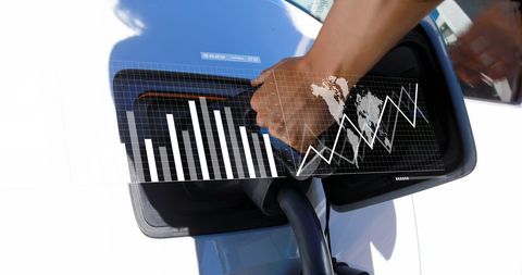 Person Charging Electric Vehicle with Digital Energy Analysis