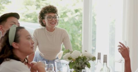Friends Celebrating with Wine at Elegant Indoor Wedding Reception