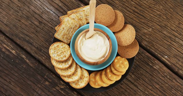 Assorted Crackers with Cream Cheese Dip on Rustic Wooden Table - Download Free Stock Images Pikwizard.com