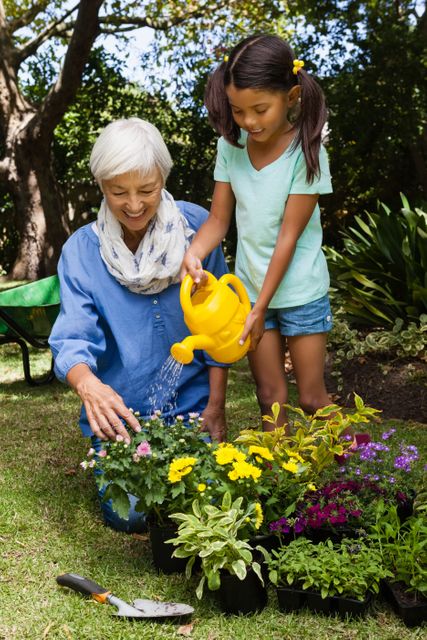 Senior woman and young girl enjoying gardening together in backyard. Perfect for illustrating family bonding, outdoor activities, and multigenerational relationships. Can be used in articles about gardening, family time, and healthy outdoor hobbies.