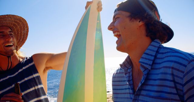 Friends Enjoying Beach Day with Surfboard and Drinks - Download Free Stock Images Pikwizard.com