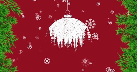 Festive bauble with snowflakes on red background and green pine